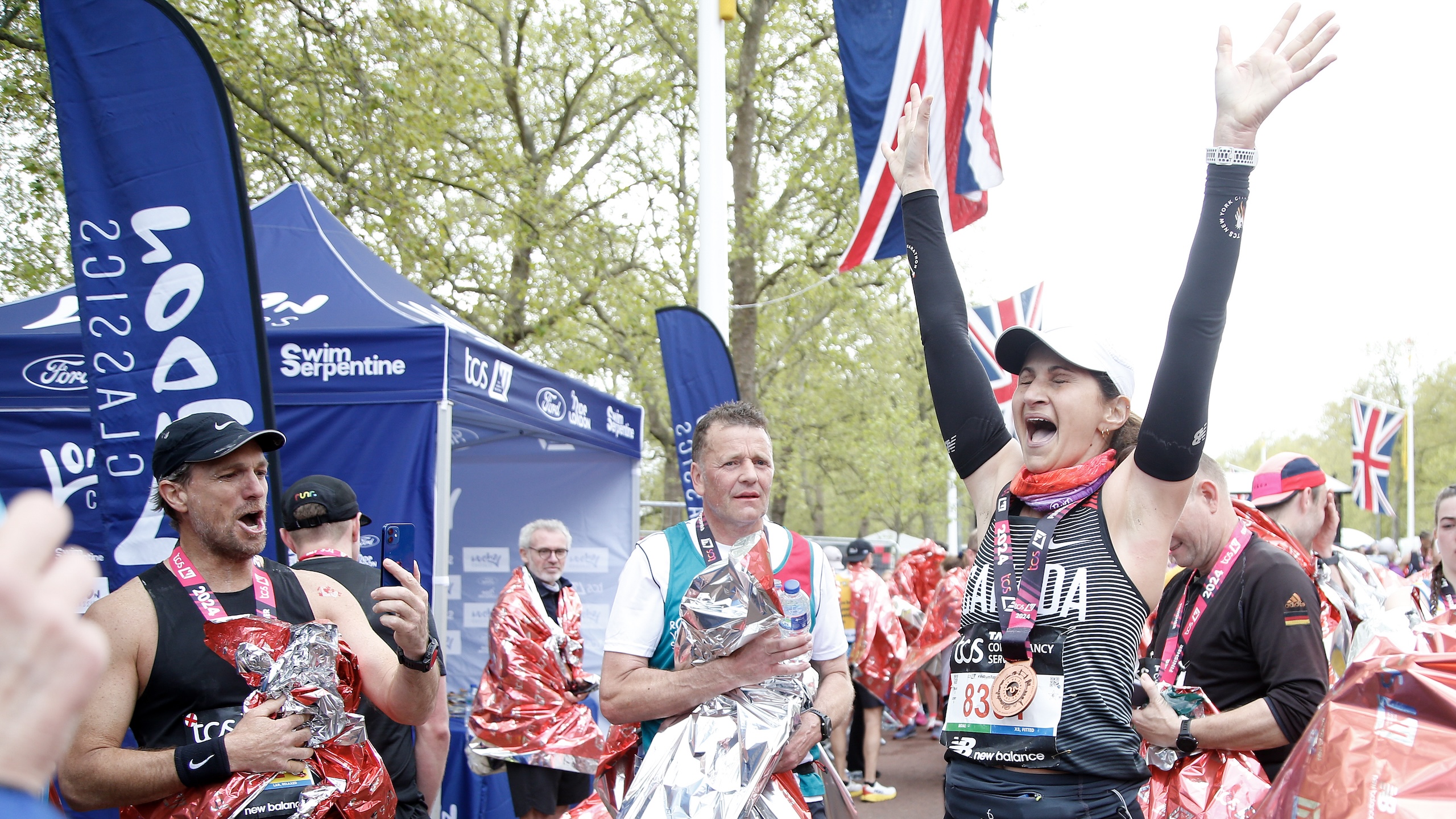 A large field of runners setting off at the start of a marathon