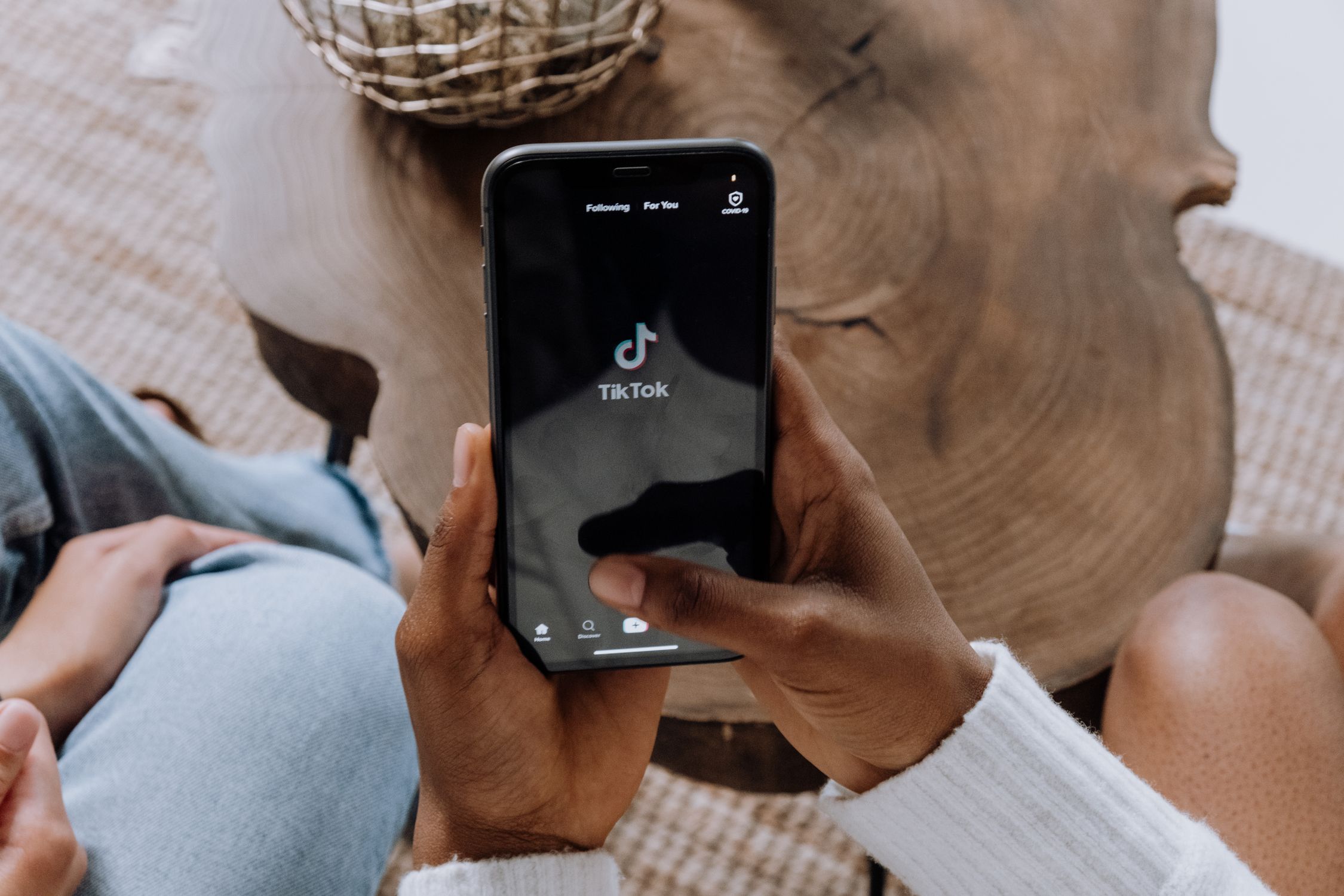 Person scrolling social media on phone