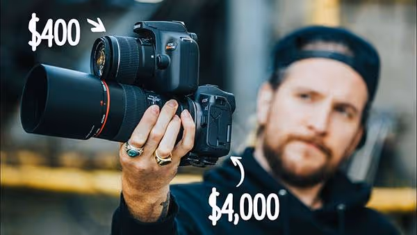 Youtube content creator Peter Mckinnon holding a camera for review