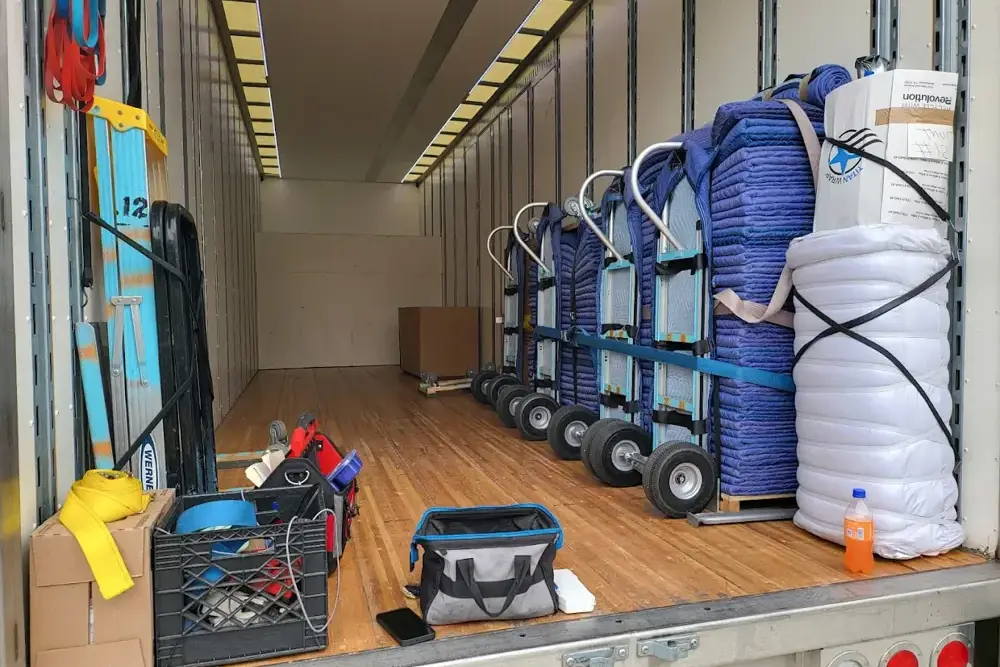 Dorm movers carrying student belongings with care