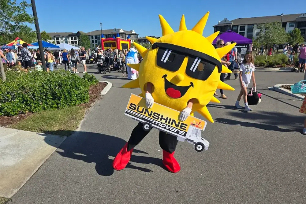 Student movers loading boxes into a moving truck