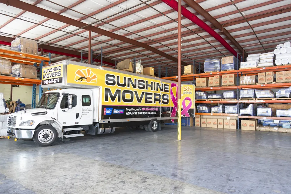 Sarasota resident organizing boxes for personal storage