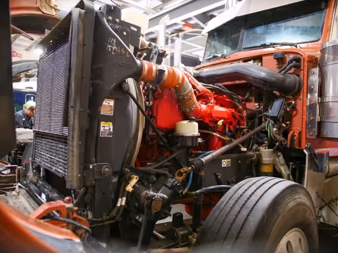 Semi-truck in shop for engine conversion service