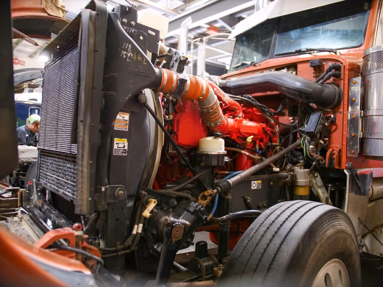 Semi-truck in shop for engine conversion service