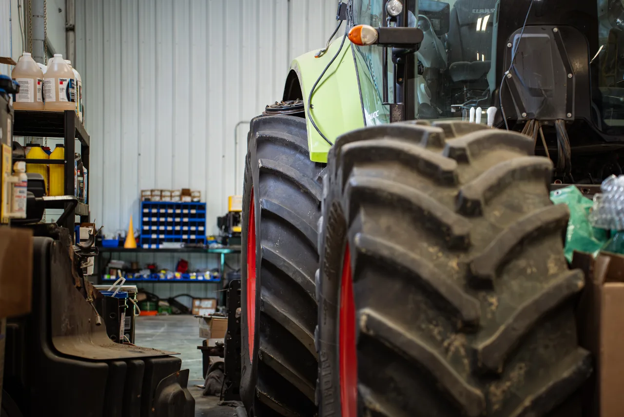 Heavy-duty tractor in an Edmonton repair shop for ECM diagnostics to identify tractor and combine power loss after harvest.
