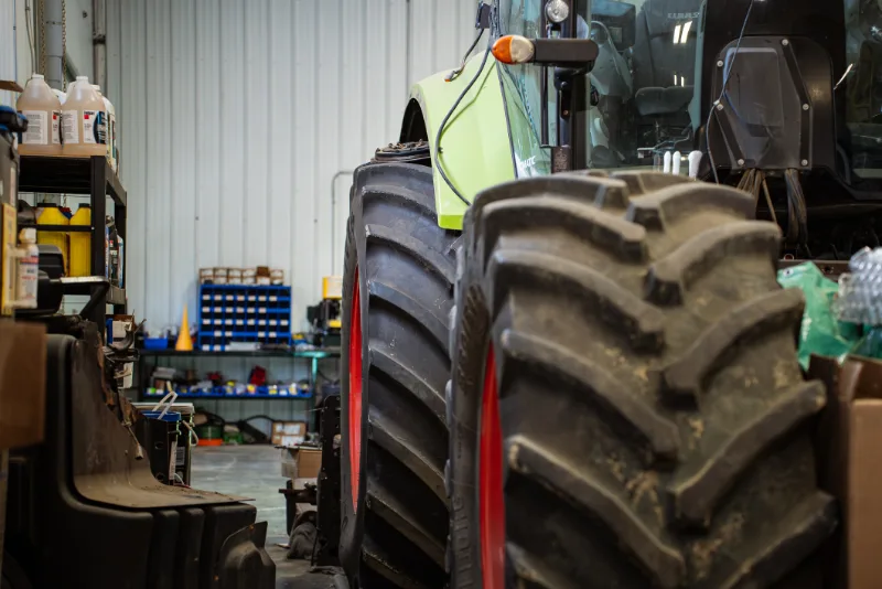 Heavy-duty tractor in an Edmonton repair shop for ECM diagnostics to identify tractor and combine power loss after harvest.
