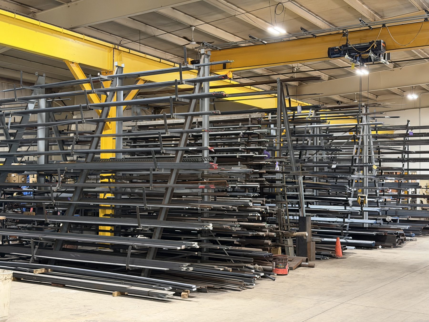 Racked steel stock under the overhead crane at Adams Steel in McHenry