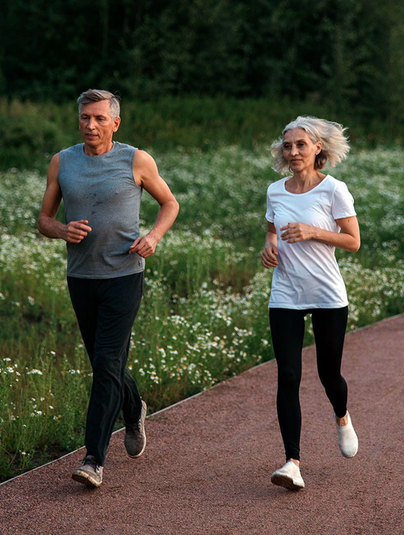 Elderly couple running together
