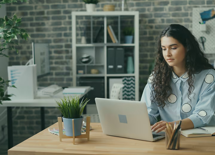 An executive working in a startup office