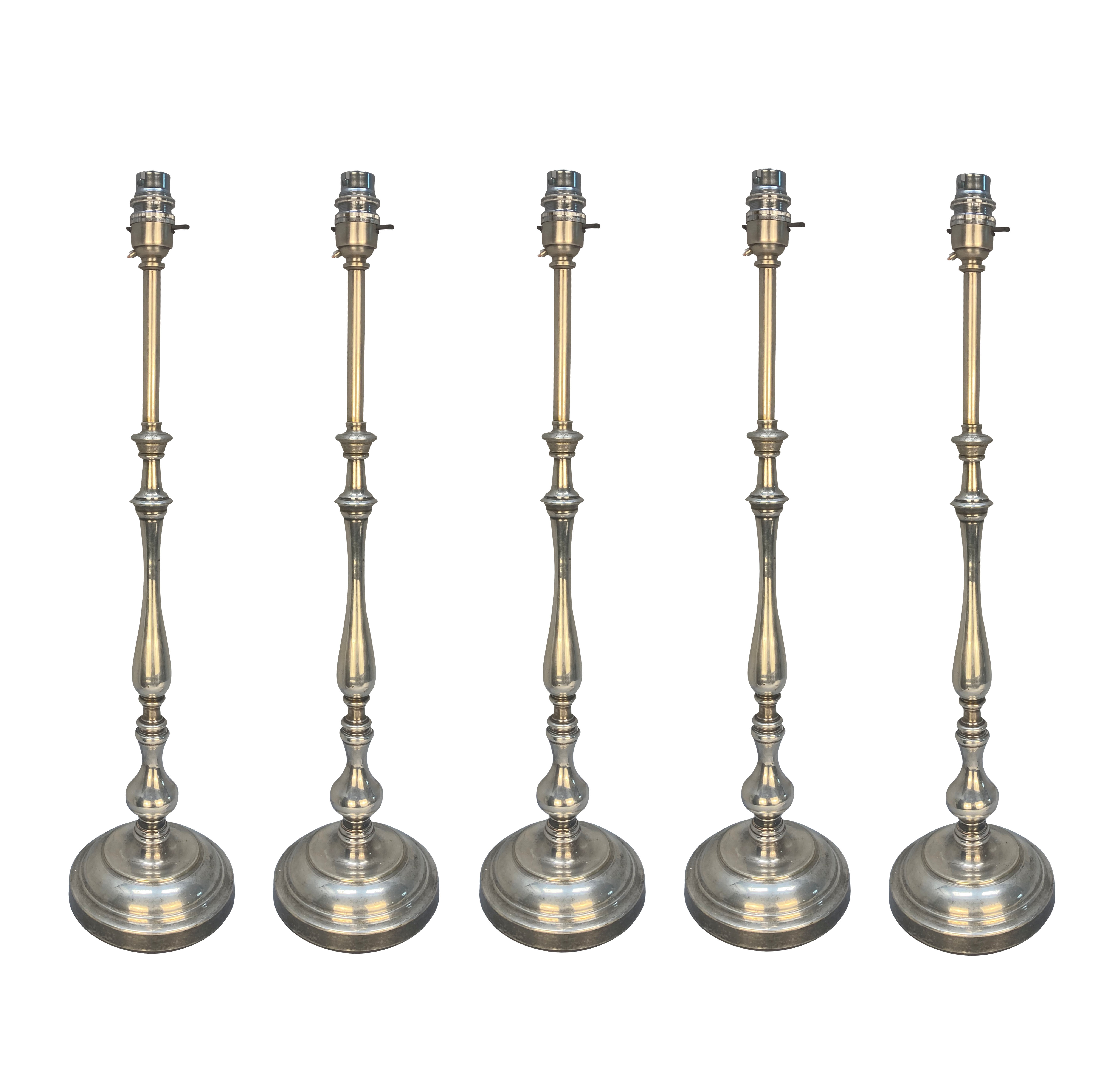 A SET OF FIVE SILVERED BRONZE SLENDER TABLE LAMPS