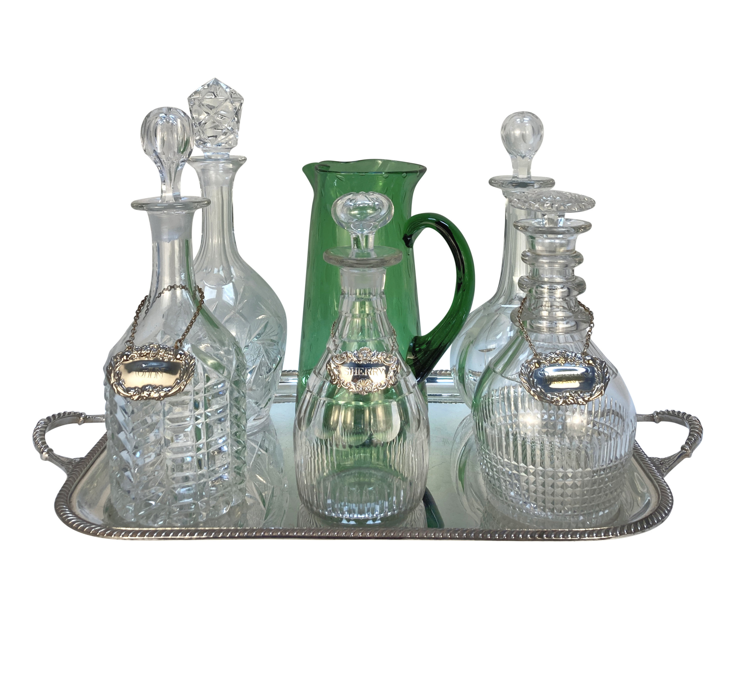 A SILVER DRINKS TRAY WITH FIVE DECANTERS & A GREEN GLASS JUG