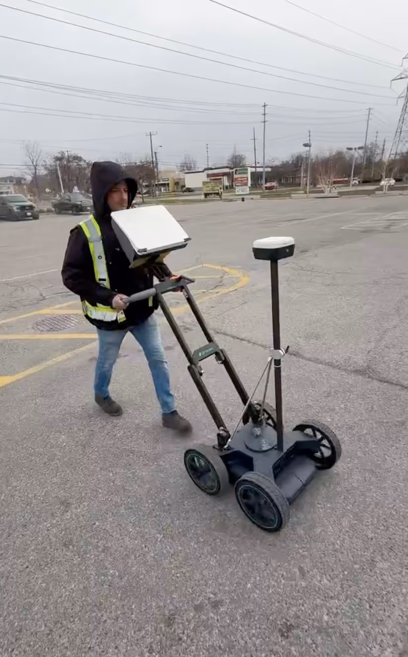 man holding digital xray equipment