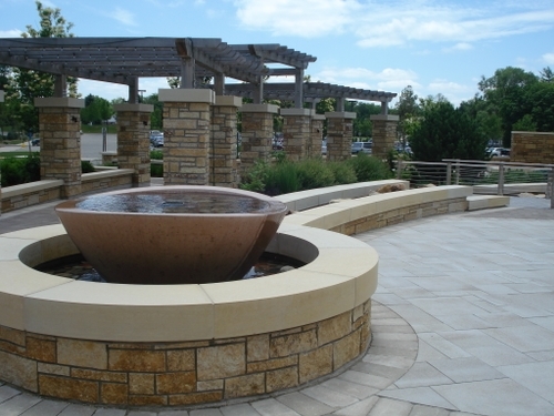 The enhanced entry experience to this important regional medical facility became a contemplative garden space and the design team took cues from the forms and materials of the building’s architecture, translating those themes into water features, custom arbors and tactile pavements.