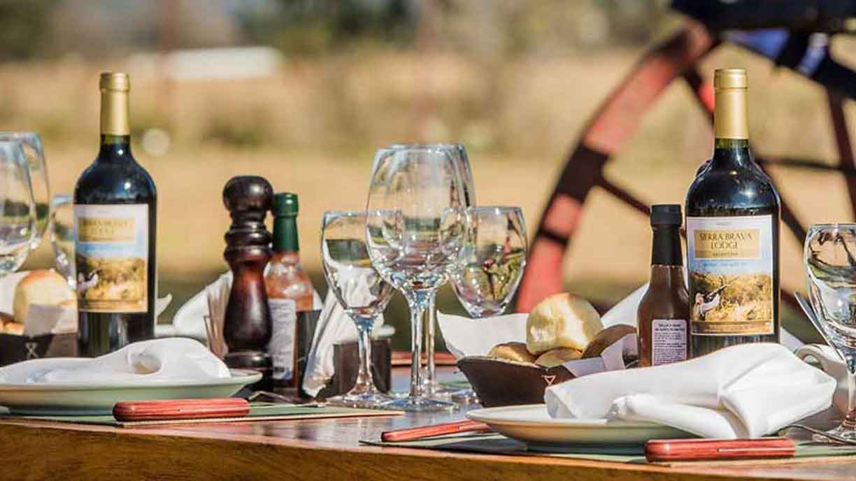 Argentine wines and glasses set out at Sierra Brava Lodge