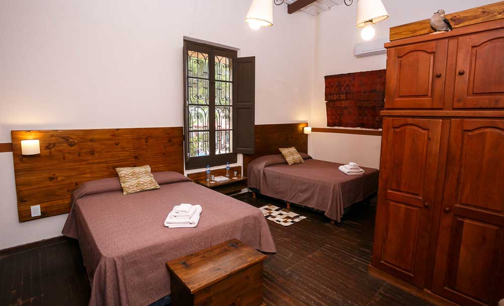 Deluxe guest room with twin beds