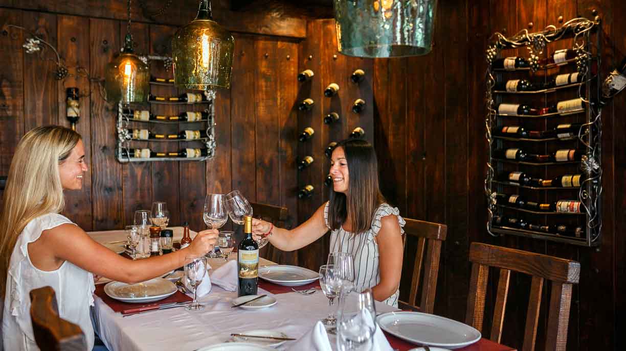 Two guests tasting wine in the cellar