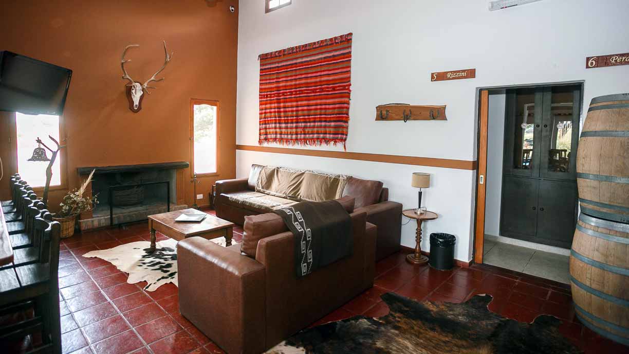 Living room with fireplace and colorful rugs