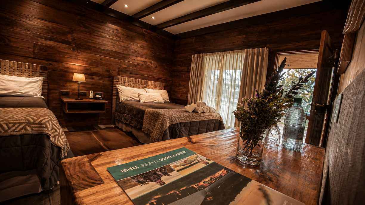 Double room with wooden table at Rio Bravo Lodge