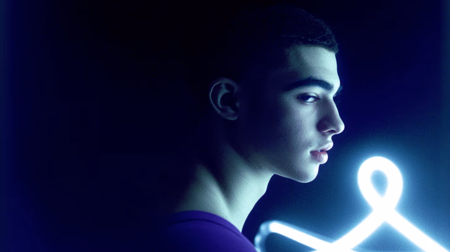 Intense MMA fighter in side profile wearing deep purple gear, illuminated by modern blue glow on a dark background.
