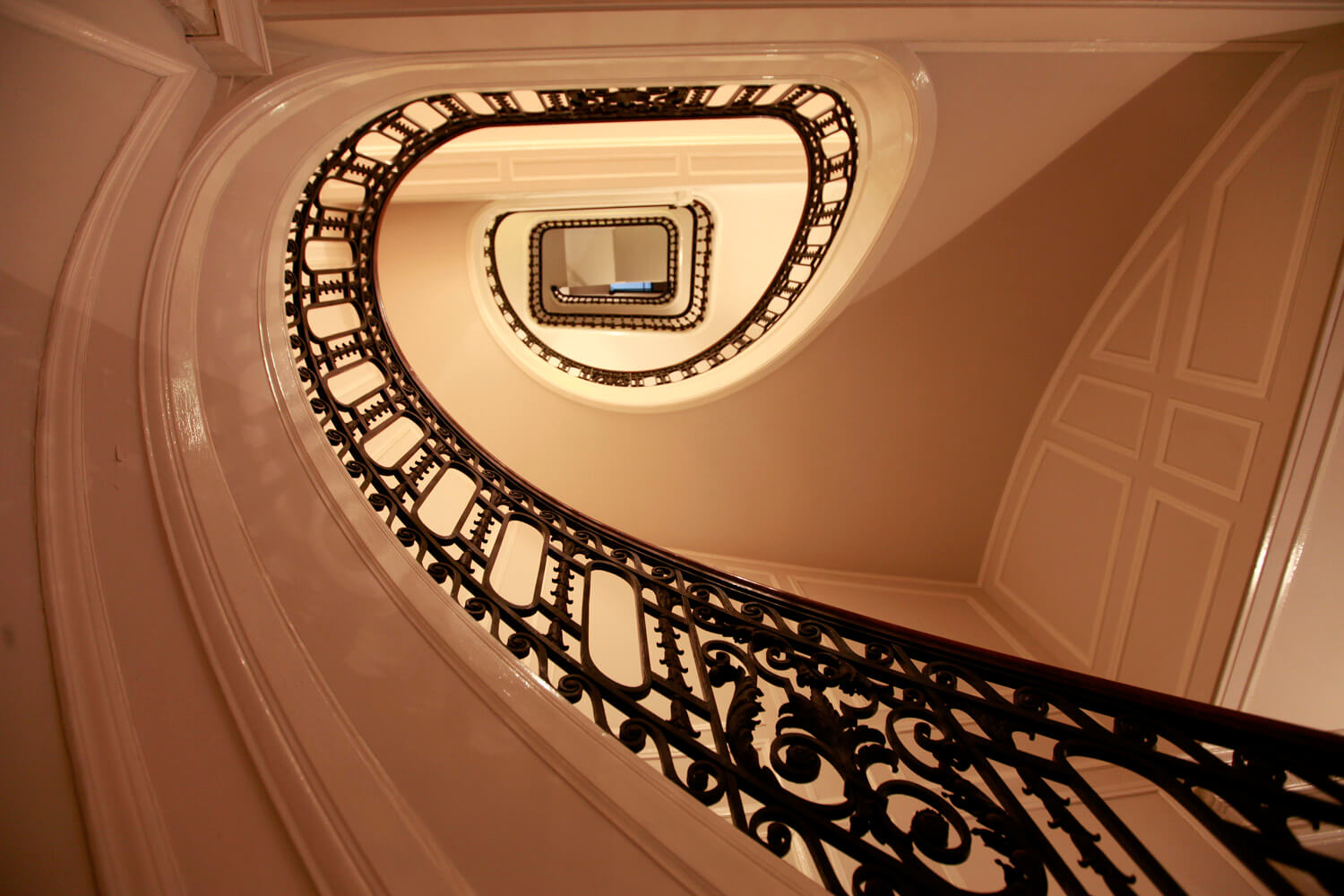 Image of the spiral staircase in 1014 Space taken from the bottom level looking up.