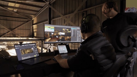 BPP Defy Your Limits motion loop, panel-talk auditorium world, Ben as the leader.