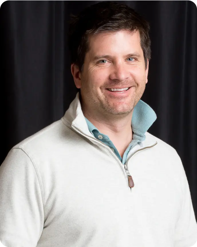Smiling portrait of David Hughes, Head of Ross Pre-School.