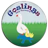 Logo of Goslings Day Nursery showing a white goose with two yellow goslings standing on a blue puddle, set against green grass. The name is in colorful letters above.