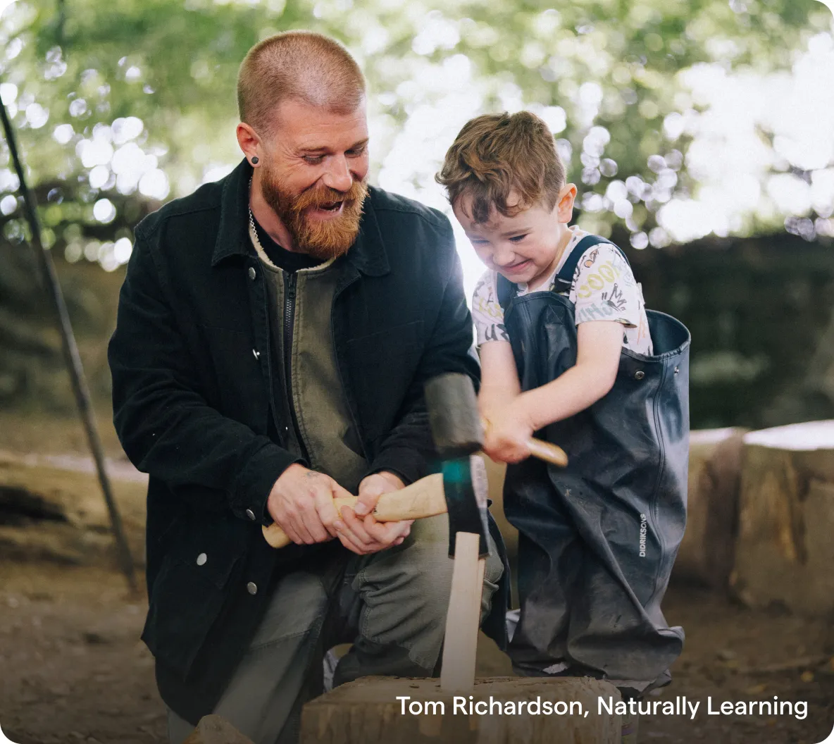 A bearded man and a young child in dungarees smiling while doing woodwork together outdoors, with the caption "Tom Richardson, Naturally Learning".