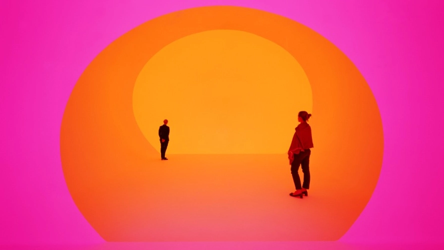 couple laying on a bed looking at each other