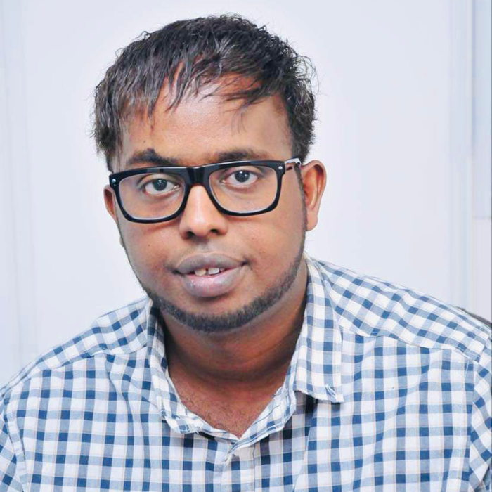 Ambassador Nick sitting in armchair