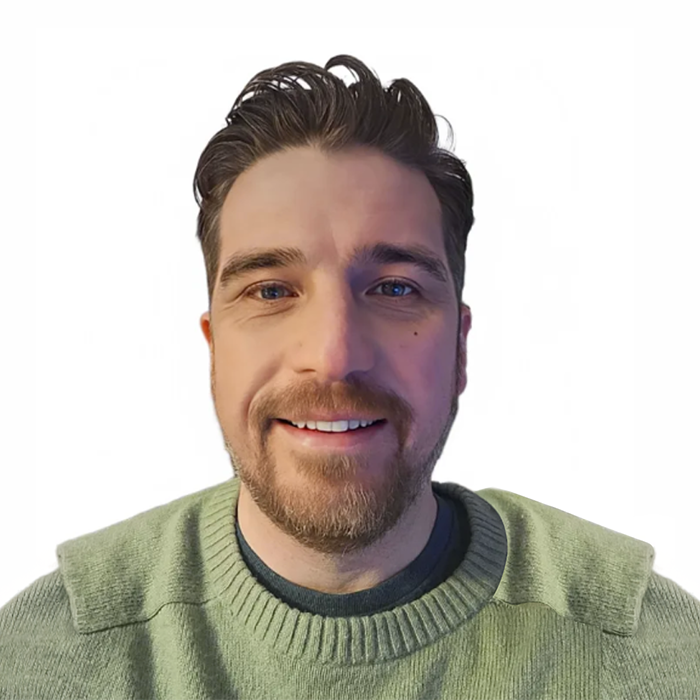 Chloe Hammond is sitting in her wheel chair with a Parallel medal round her neck whilst her guide dog Ocho is sitting beside her wearing a red dog tag