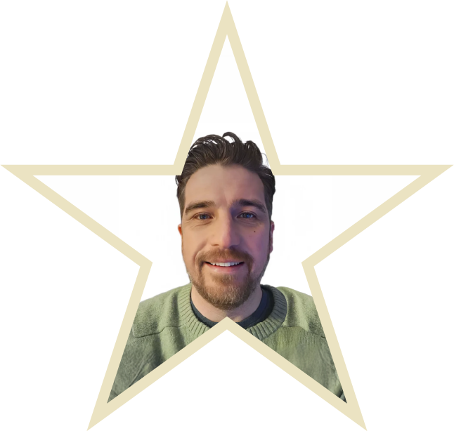 Chloe Hammond is sitting in her wheel chair with a Parallel medal round her neck whilst her guide dog Ocho is sitting beside her wearing a red dog tag