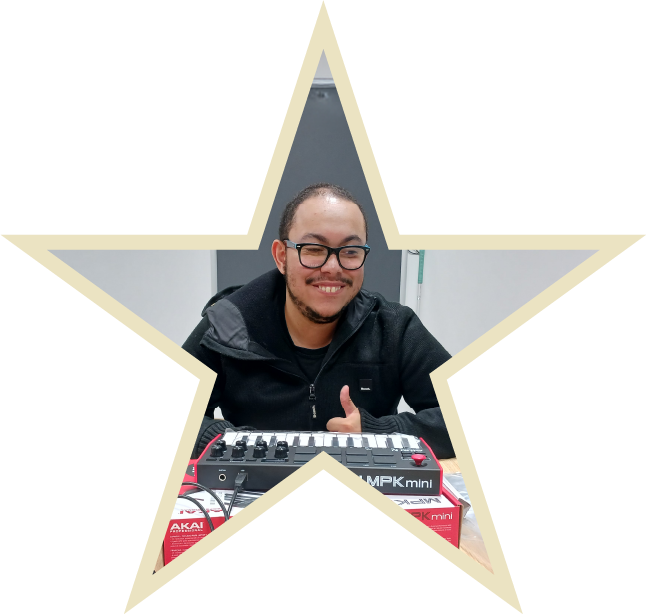 Chloe Hammond is sitting in her wheel chair with a Parallel medal round her neck whilst her guide dog Ocho is sitting beside her wearing a red dog tag