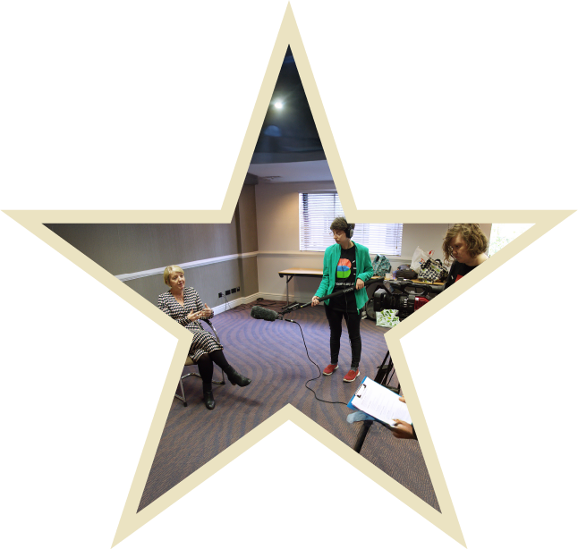 Sally Philips smiling at the camera.