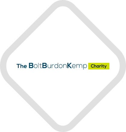 The Bolt Burdon Kemp Charity logo inside a light grey diamond, with the name in dark blue text and the word “Charity” highlighted in a small yellow rectangle