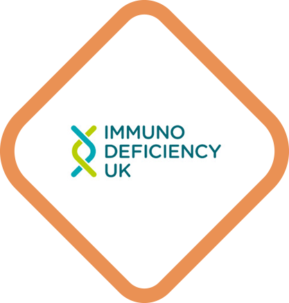 Logo for Immunodeficiency UK featuring a stylized DNA helix in green and blue next to the words ‘Immunodeficiency UK’ inside a rounded diamond shape with an bronze border