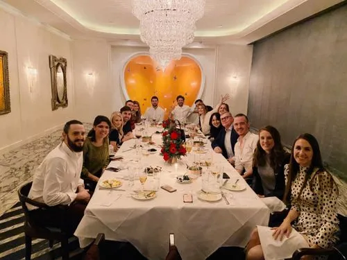 A group of people sitting at a table