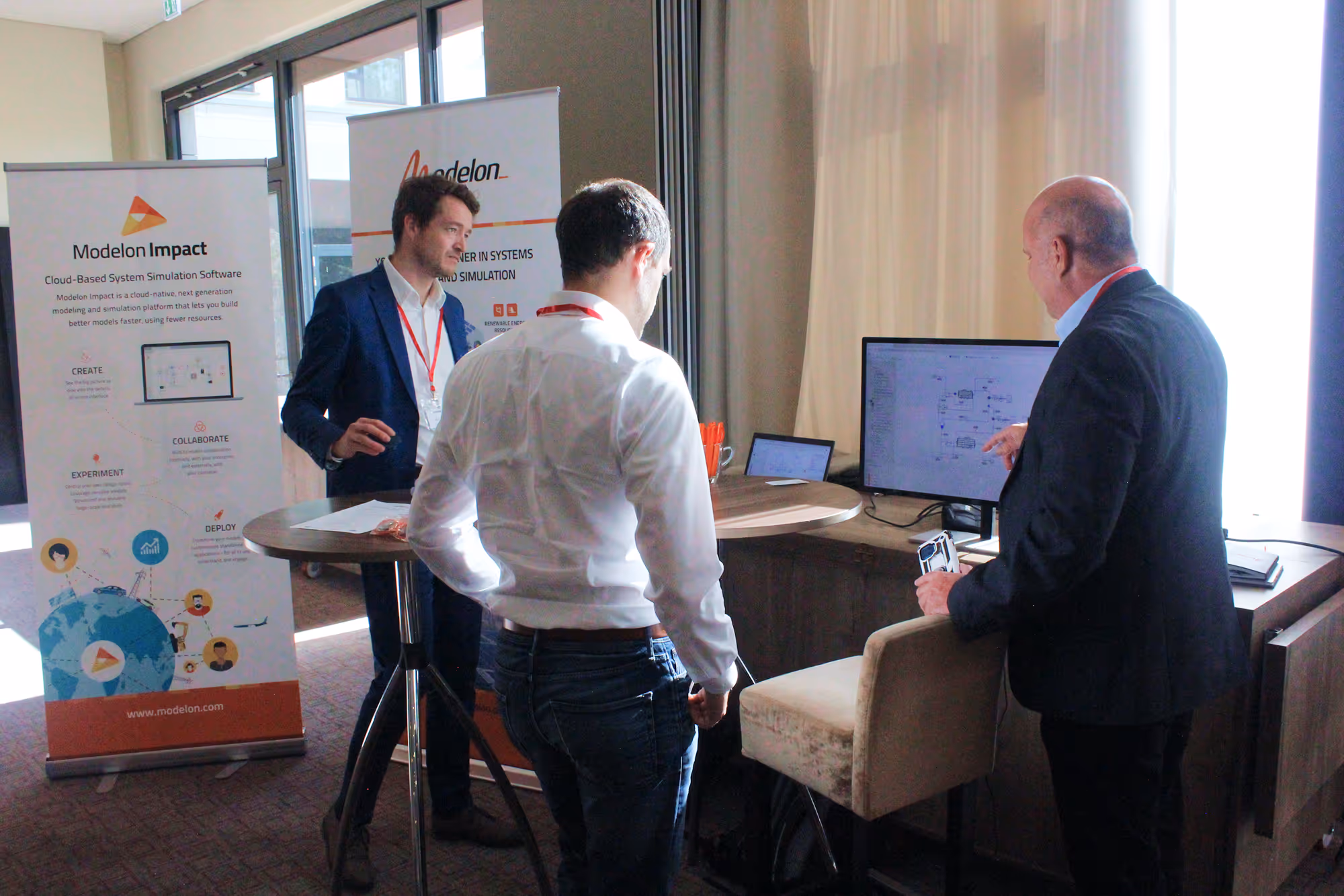 Cup of black coffee on a saucer next to a plate with a slice of crumb cake and a fork on a wooden table.