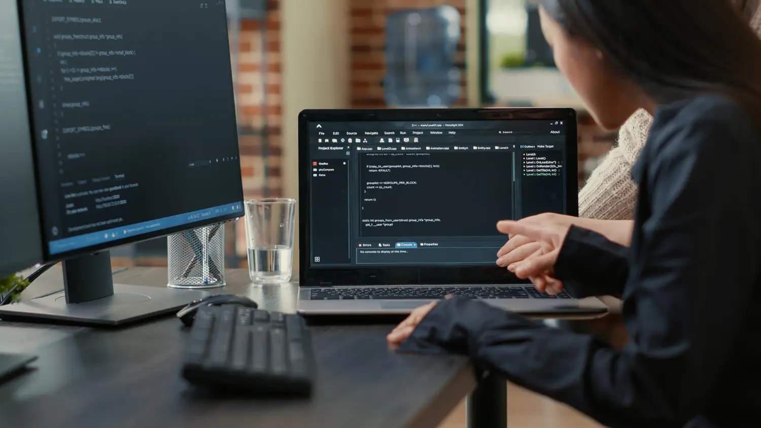 Website maintenance and development on a laptop and desktop computer