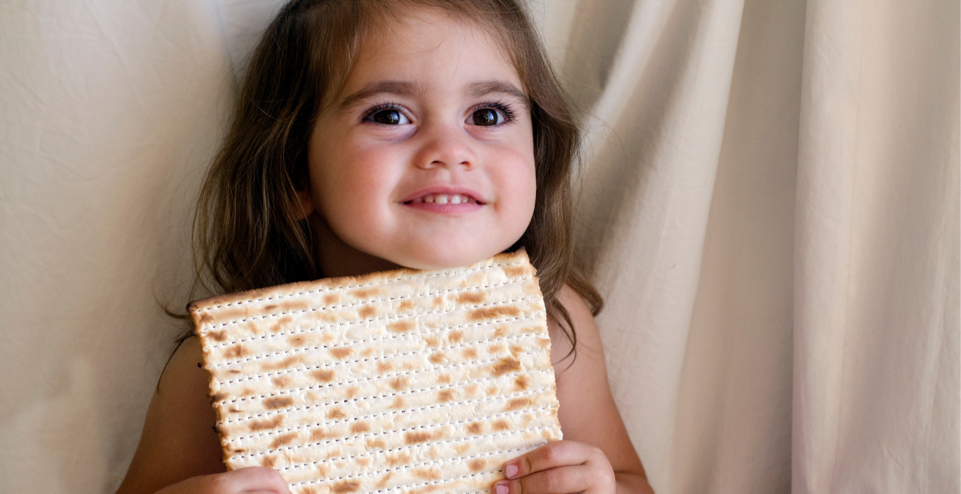 Child holding matzah
