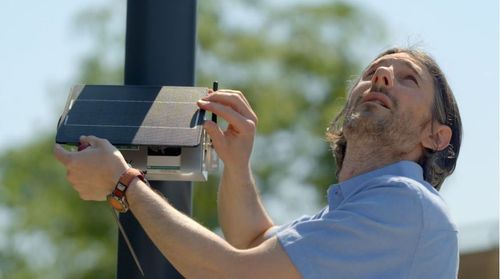 person placing a node-s system