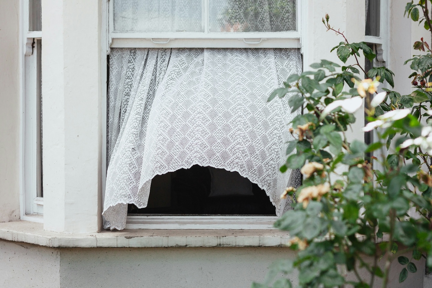 Open window with breeze blowing through, bringing ambient air pollution and particulate matter inside and vice versa. 