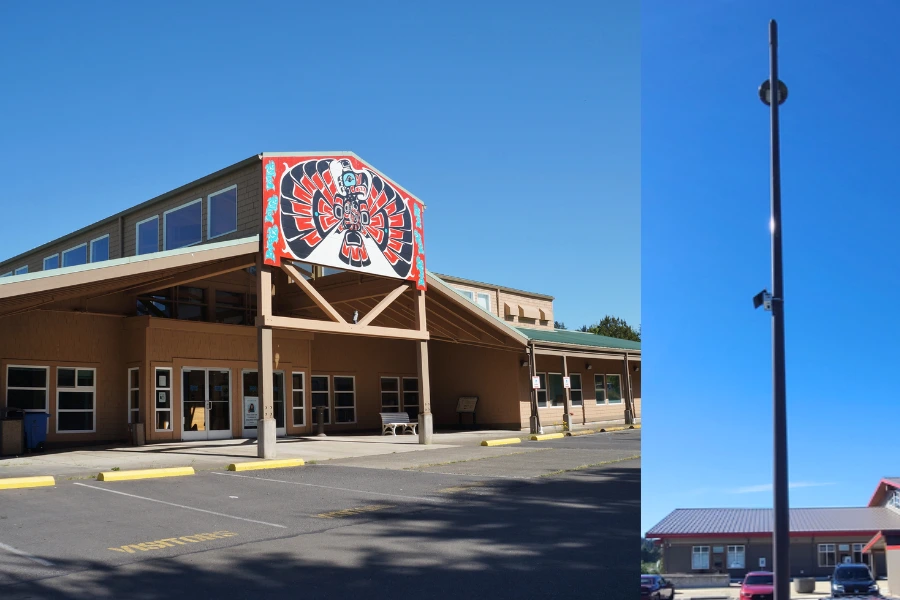 Image of a Clarity Node-S air quality sensor and a building on the Quinault Reservation, where Clarity air quality measurement is employed for air quality monitoring on the tribal reservation.,