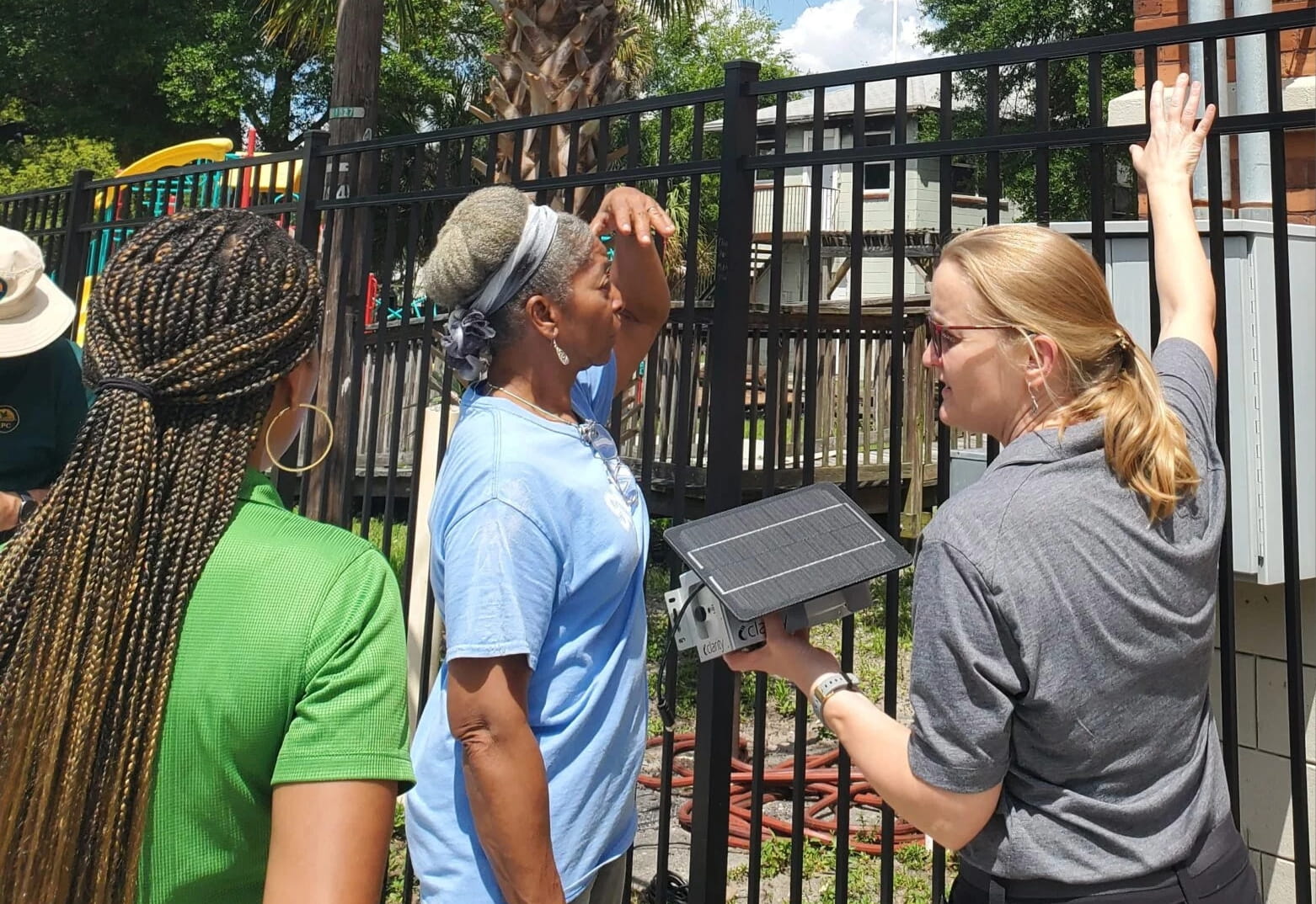 Dr. Stuart with a Node-S air quality sensor, demonstrating the Hillsborough Community Air Quality Monitoring Network (CAMN).