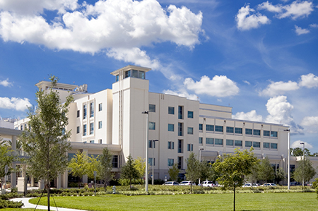 hospital building with blue sky above