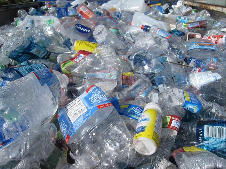A large pile of squished plastic bottles