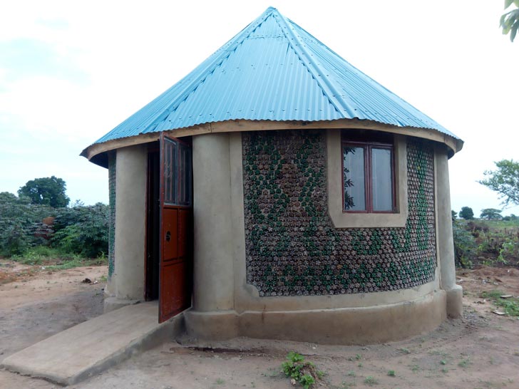 A circular hut made of plastic bottles in Uganda