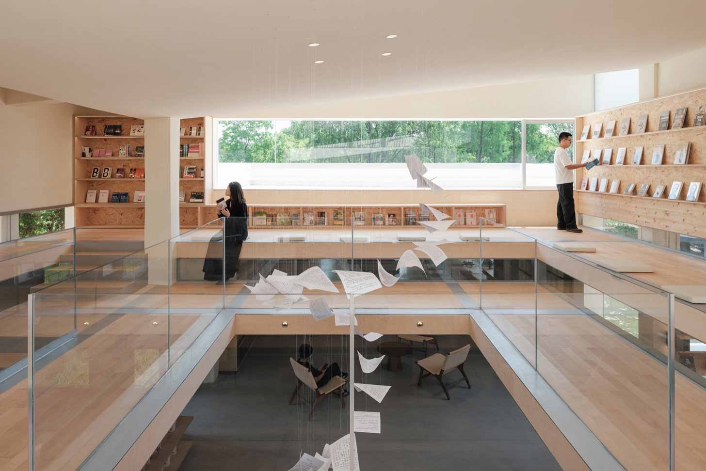 An installation of book pages towers through a modern bookstore in China