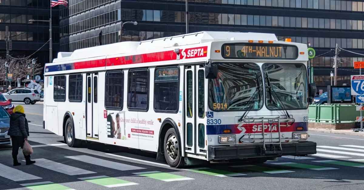 A moving bus in the middle of the road