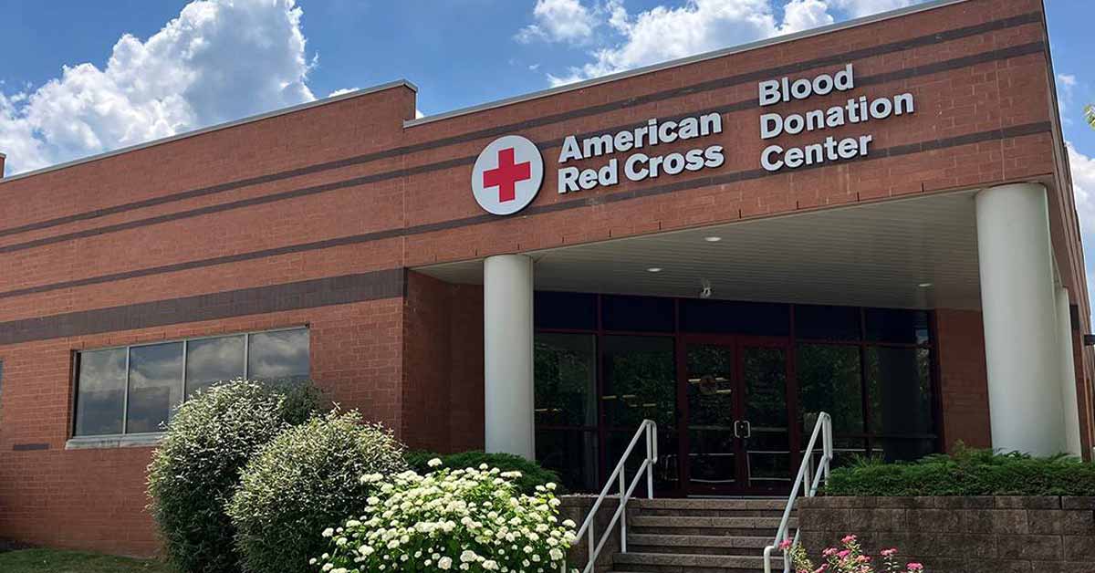The front of a brick building reads "American Red Cross Donation Center"